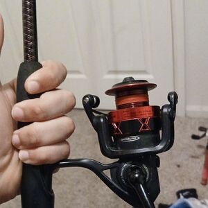 Red and Black Fishing Reel